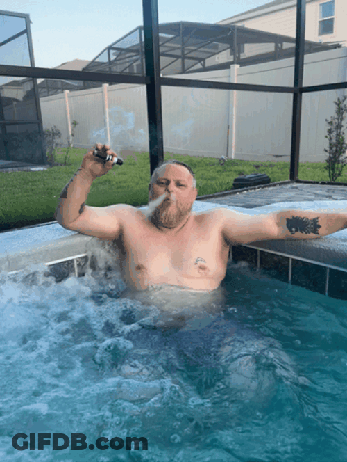 Relaxing And Smoking Cigar In Pool GIF