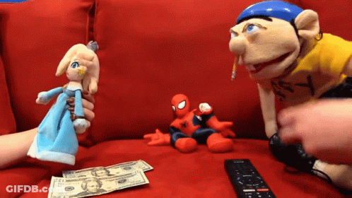 Remote Control Next To Spiderman And Princess Puppets GIF