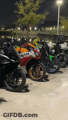 Repsol Motorcycles Parked At Night GIF