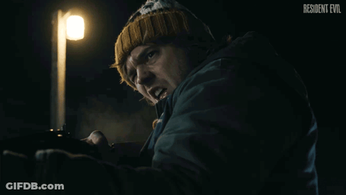 Resident Evil Poster Man Holding Gun GIF