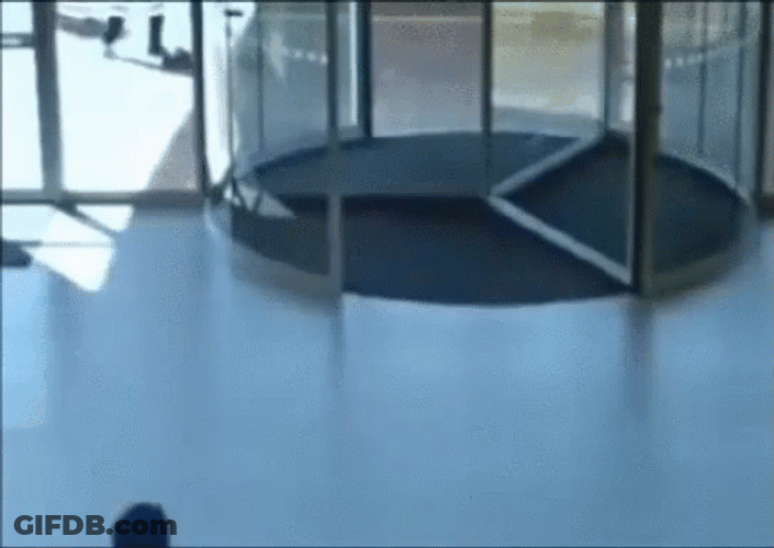 Revolving Door Glass Running Hit GIF