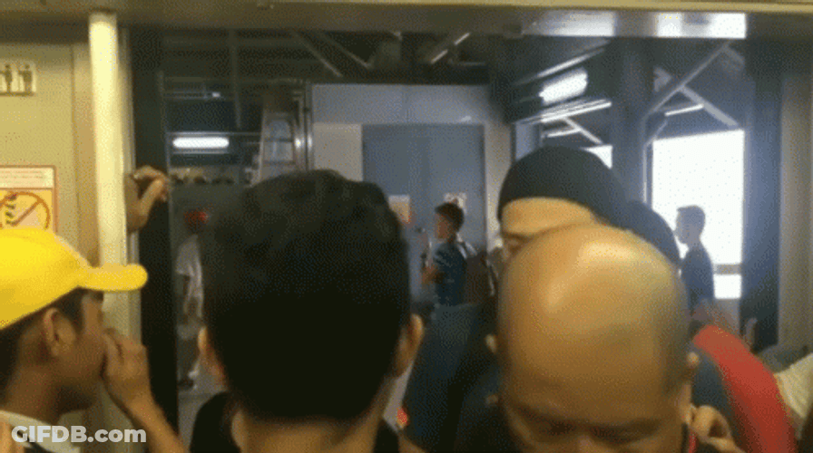 Revolving Door Train Full Crowd GIF