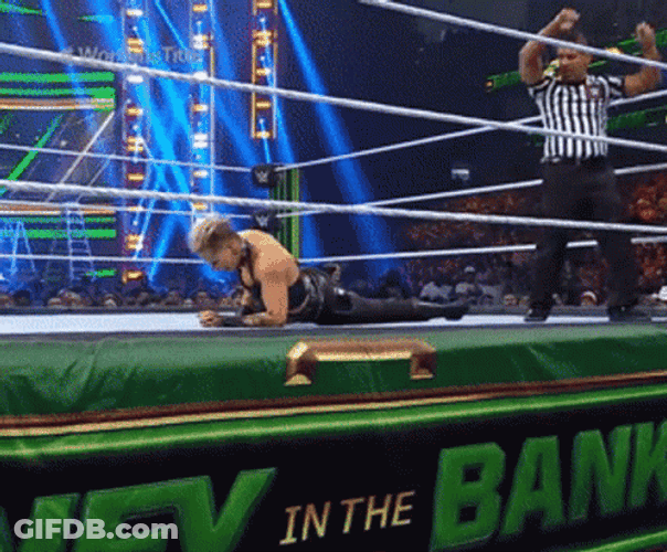 Rhea Ripley Bangs Head Against Wall GIF