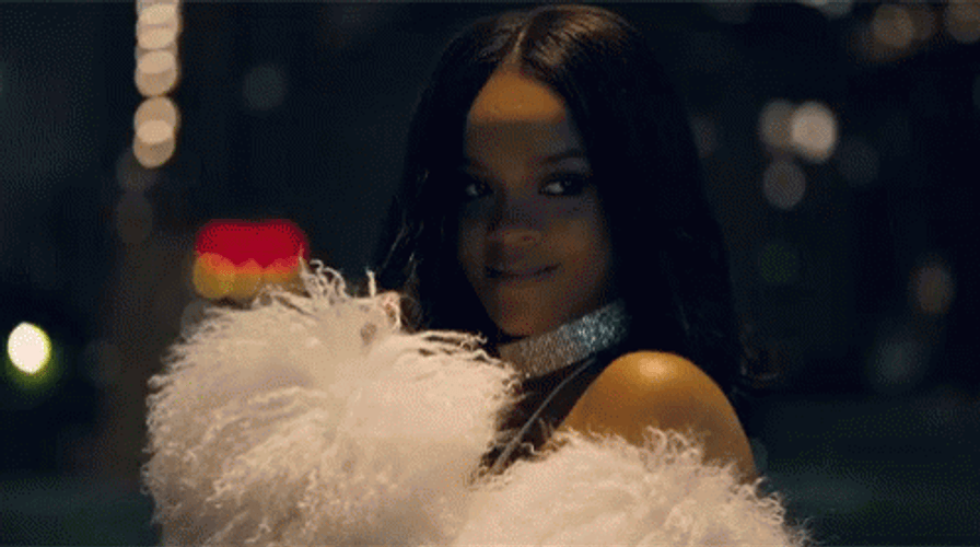 Rhianna Wearing Feathered Coat Flirt Look GIF