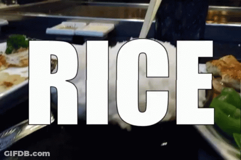 Rice Is Being Poured Into A Glass With Chopsticks GIF