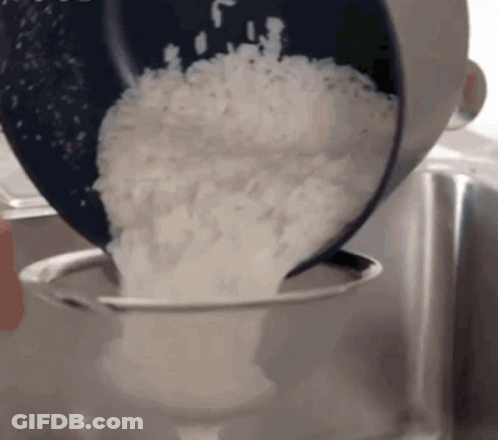 Rice Poured From Pot Into Strainer GIF