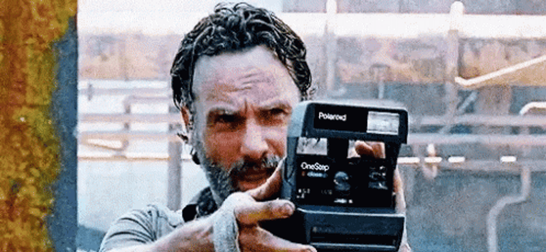 Rick Grimes Using Polaroid Camera GIF