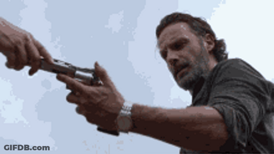 Rick Grimes Walking Dead Holding And Assessing Gun GIF