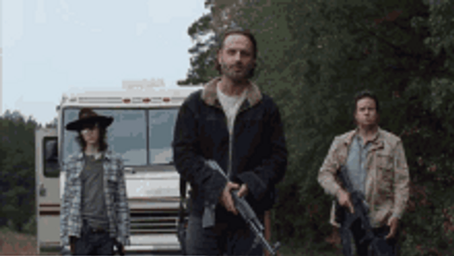 Rick Grimes Walking Dead Holding Gun With Companions GIF