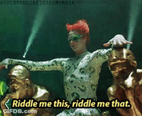 Riddle Me This Riddle Me That Is Written In Yellow Letters GIF
