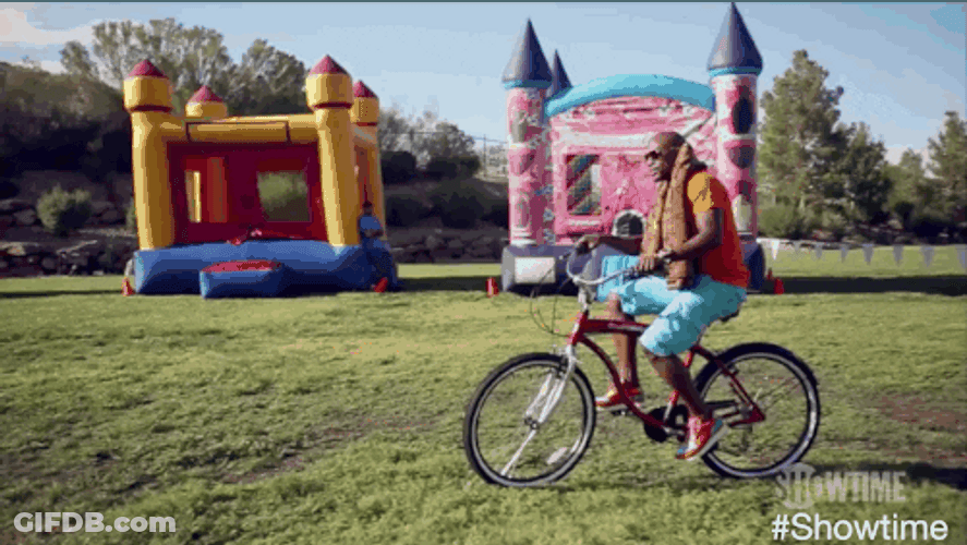 Riding Bike In The Grass GIF
