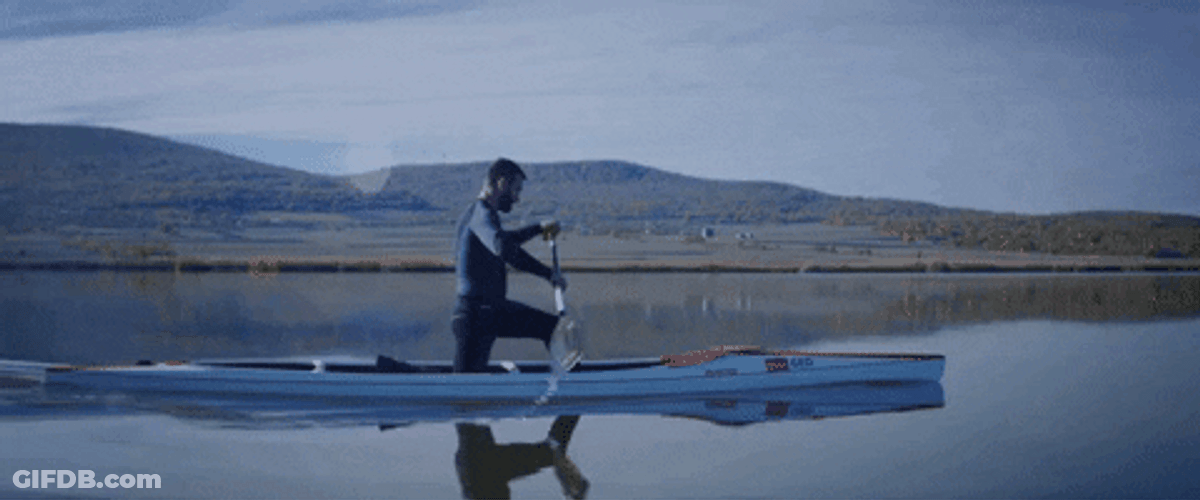 Riding The Canoe In The Plain Water GIF