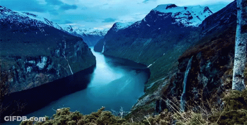 River Flowing Through Mountain Valley GIF