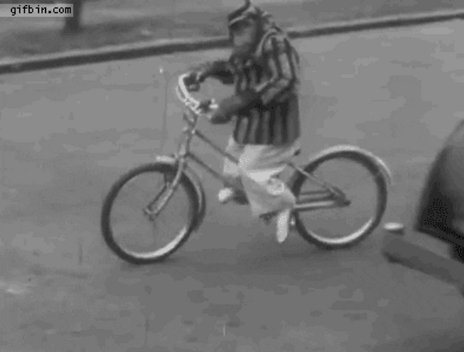 Rizz Vintage Monkey Riding Bike GIF