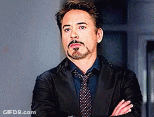 Robert Downey Jr. Arms Crossed In Suit And Tie GIF