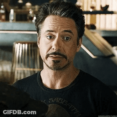 Robert Downey Jr. Is Wearing A Black Shirt That Says Sabbath On It . GIF