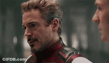 Robert Downey Jr. Talking To Man In Red And White Suit GIF