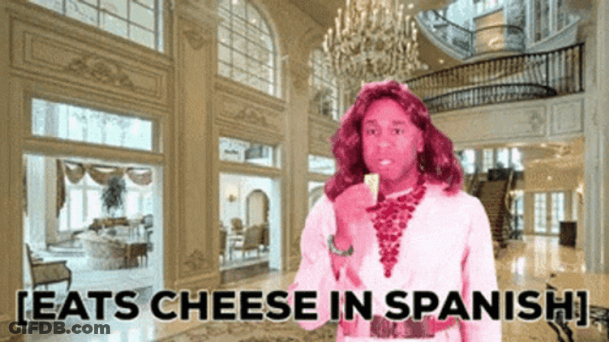 Robert E Blackmon Eats Cheese In Spanish GIF