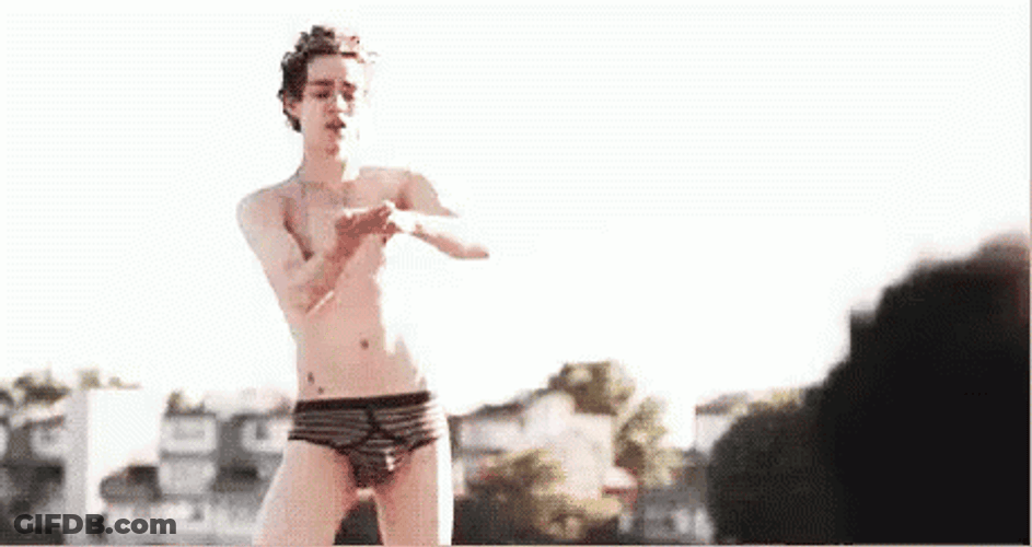 Robert Sheehan Putting Lotion On Thigh GIF