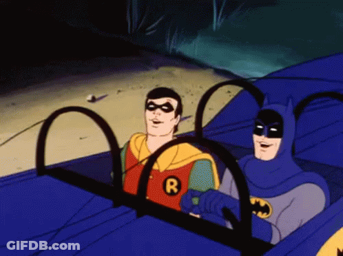 Robin And Batman Sitting In Car With Letter R On Shirts GIF