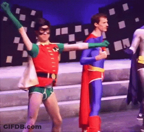 Robin And Superman Are Dancing Together On Stage GIF