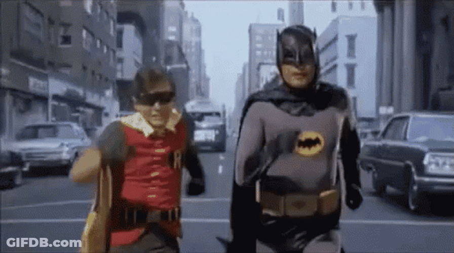 Robin Running With Superman GIF