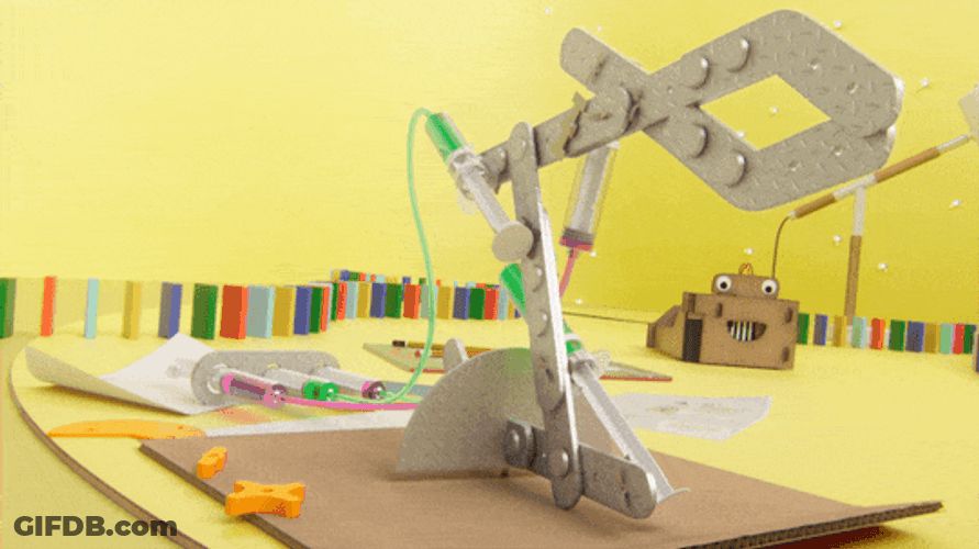 Robot Arm Toppling Dominoes GIF