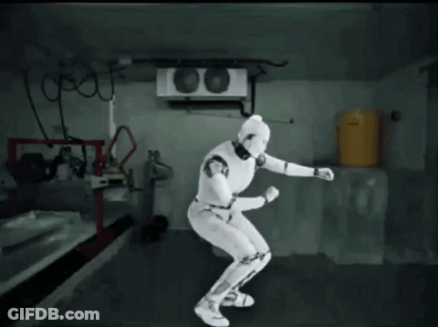 Robot Dancing Behind Yellow Barrel GIF