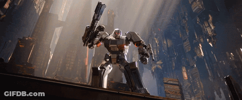 Robot Holding Gun With Letters TC GIF