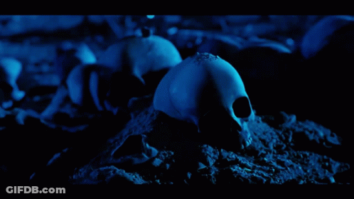 Robot Holding Machine Gun On Dark Blue GIF