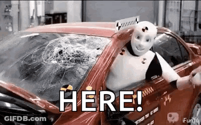 Robot In Car With Broken Windshield Saying Here GIF