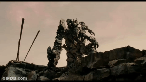 Robot On Pile Of Rocks GIF