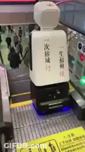 Robot Sitting On Escalator With Chinese Writing GIF