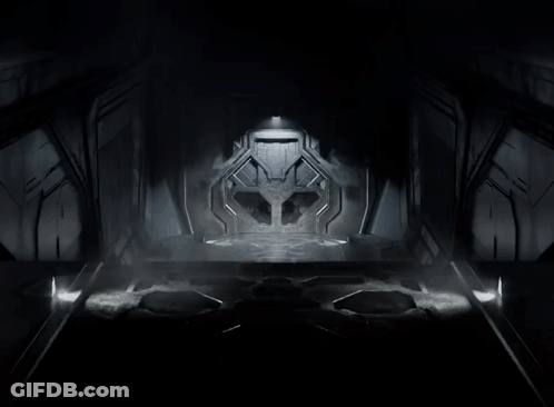 Robot Standing In Dark Room With Light Shining GIF