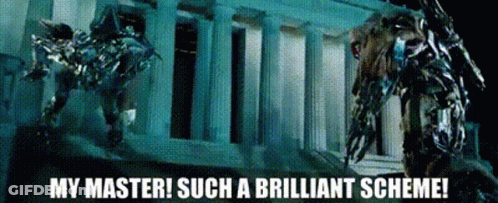 Robot Standing In Front Of Building Saying My Master Such A Brilliant Scheme GIF