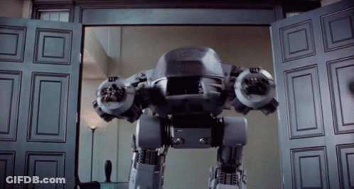 Robot Standing In Front Of Door GIF