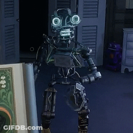 Robot Standing Next To Book With Lion Picture GIF