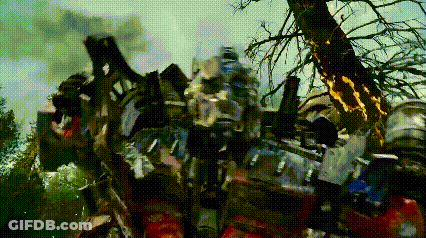 Robot Standing Next To Smoking Tree GIF