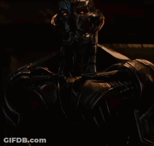 Robot Statue In Busy City Street GIF