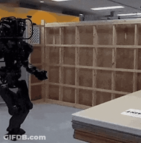 Robot Walking In Room With Wooden Shelf GIF