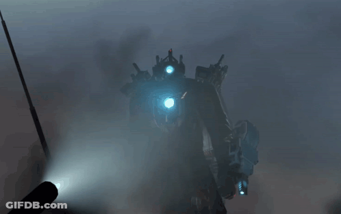 Robot With Blue Lights Standing In Fog GIF
