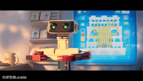 Robot With Green Eyes Standing In Front Of Monitor GIF