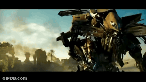 Robot With Gun On Back In Desert GIF