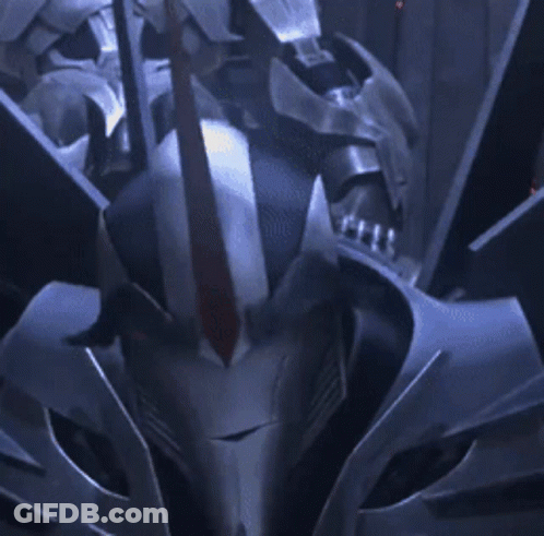 Robot With Red Eyes Looking At Camera GIF