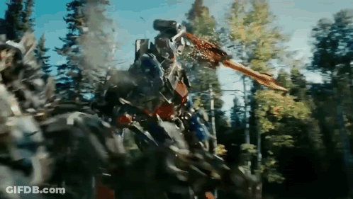Robot With Sword Standing In Woods GIF