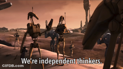 Robots Standing In Desert With We Are Independent Thinkers GIF