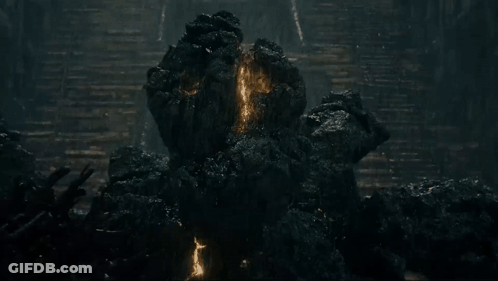 Rock Monster Statue On Rocky Hillside GIF