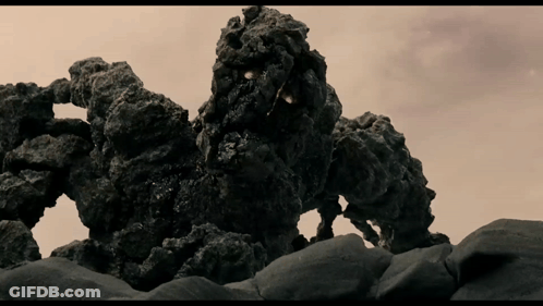 Rock Monster Statue On Rocky Hillside GIF