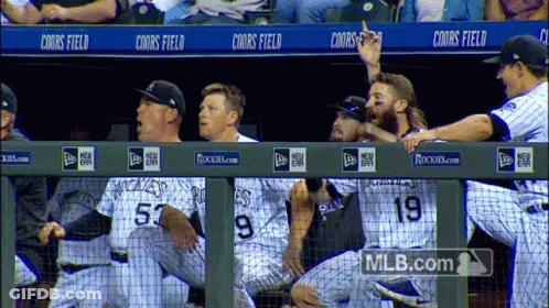 Rockies Baseball Players Sitting On Dugout GIF