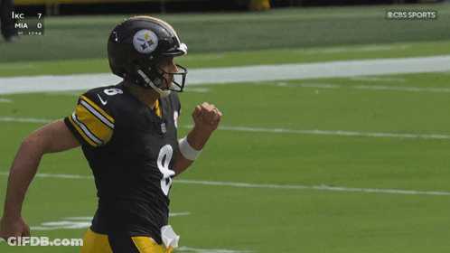 Rodgers Kneeling On Field With Arms In Air GIF